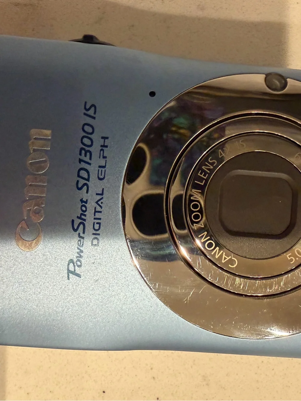 Canon Power Shot SD1300 IS digital camera features a 12.1-megapixel CCD sensor